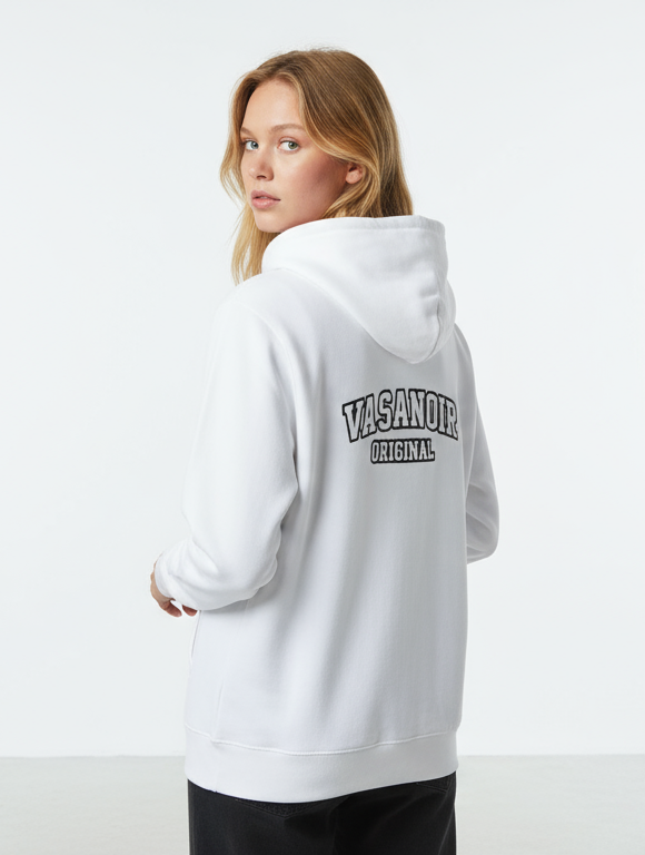 Person wearing a white hoodie with 'Vans' branding on the back, standing against a plain background.